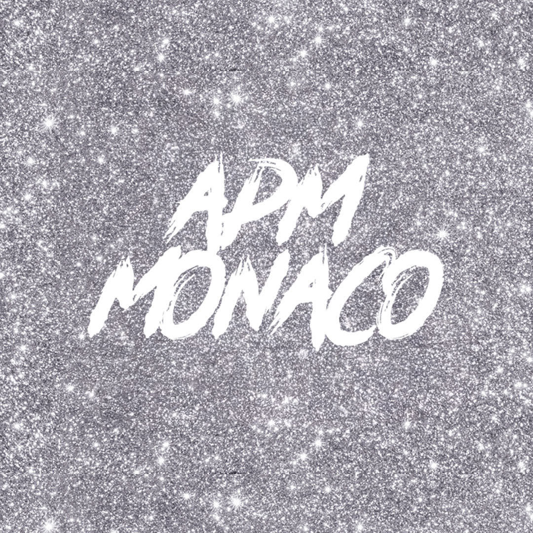 APM MONACO gift card on a glittery silver background