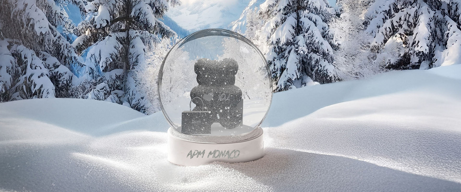 APM MONACO snow globe with a teddy bear inside on a snowy landscape