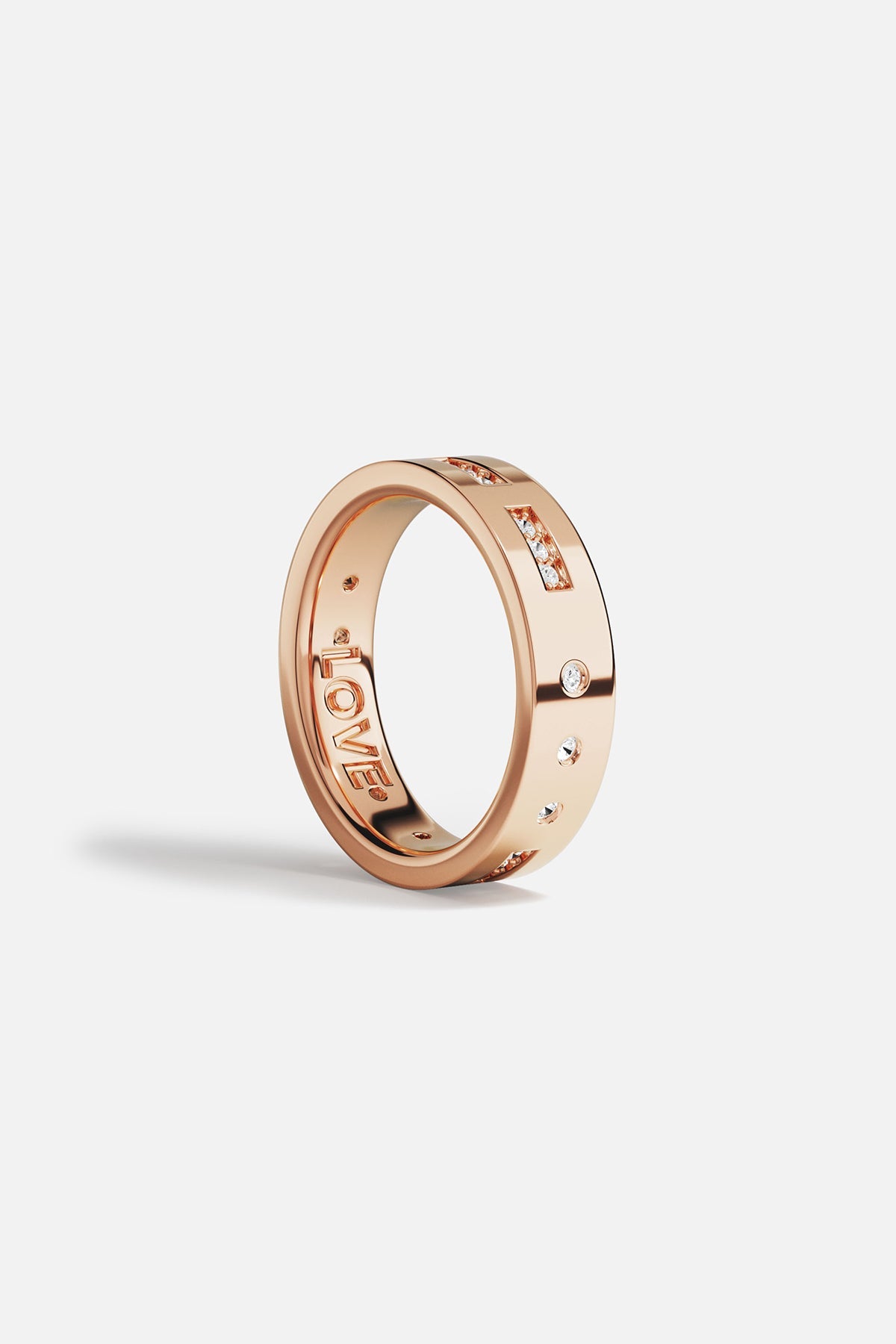 Rings APM Monaco. Rose gold ring featuring a LOVE Morse-code design with small diamonds and star accents.