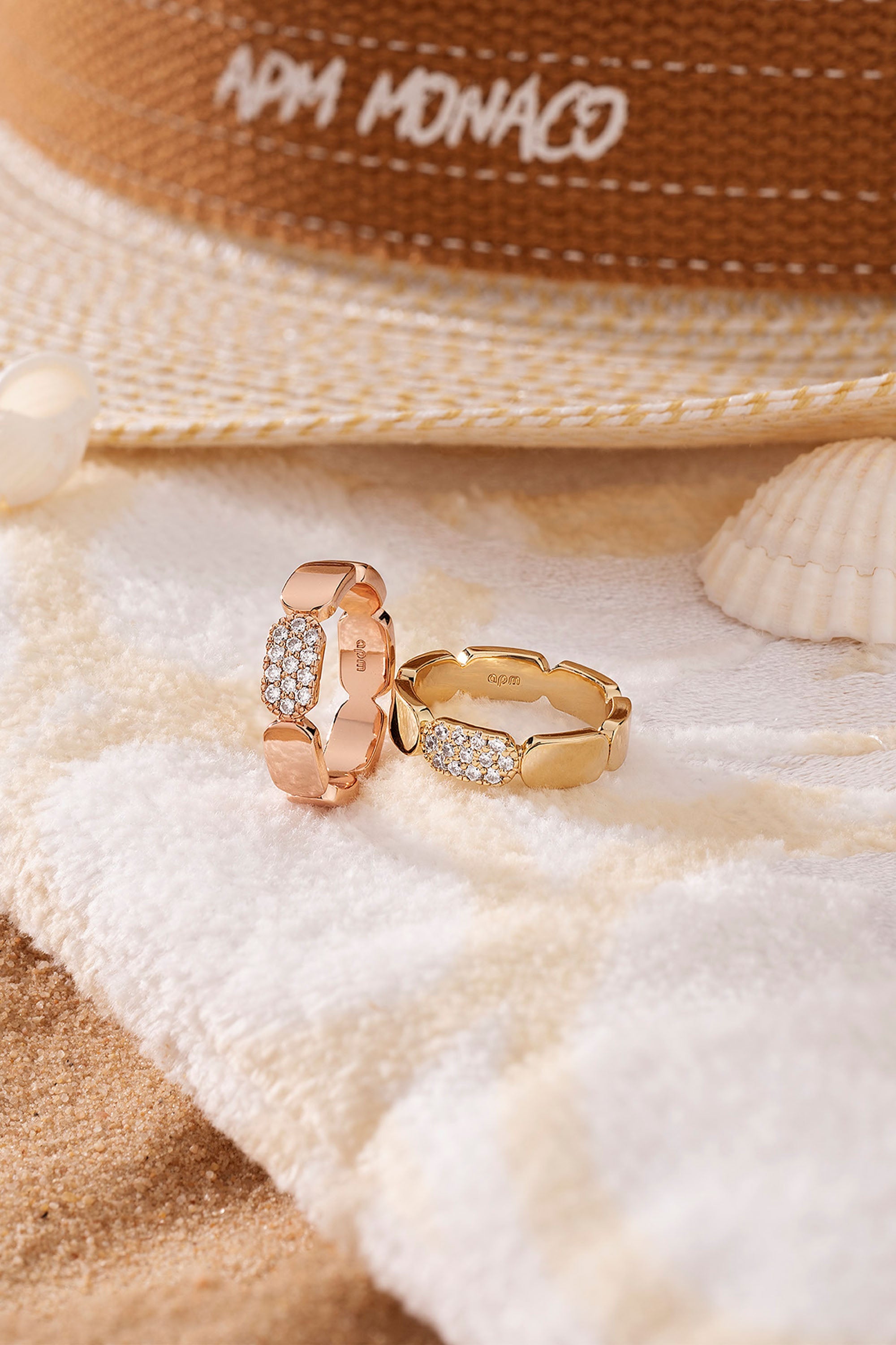 APM Monaco Dainty Rose Gold Ring on soft blanket