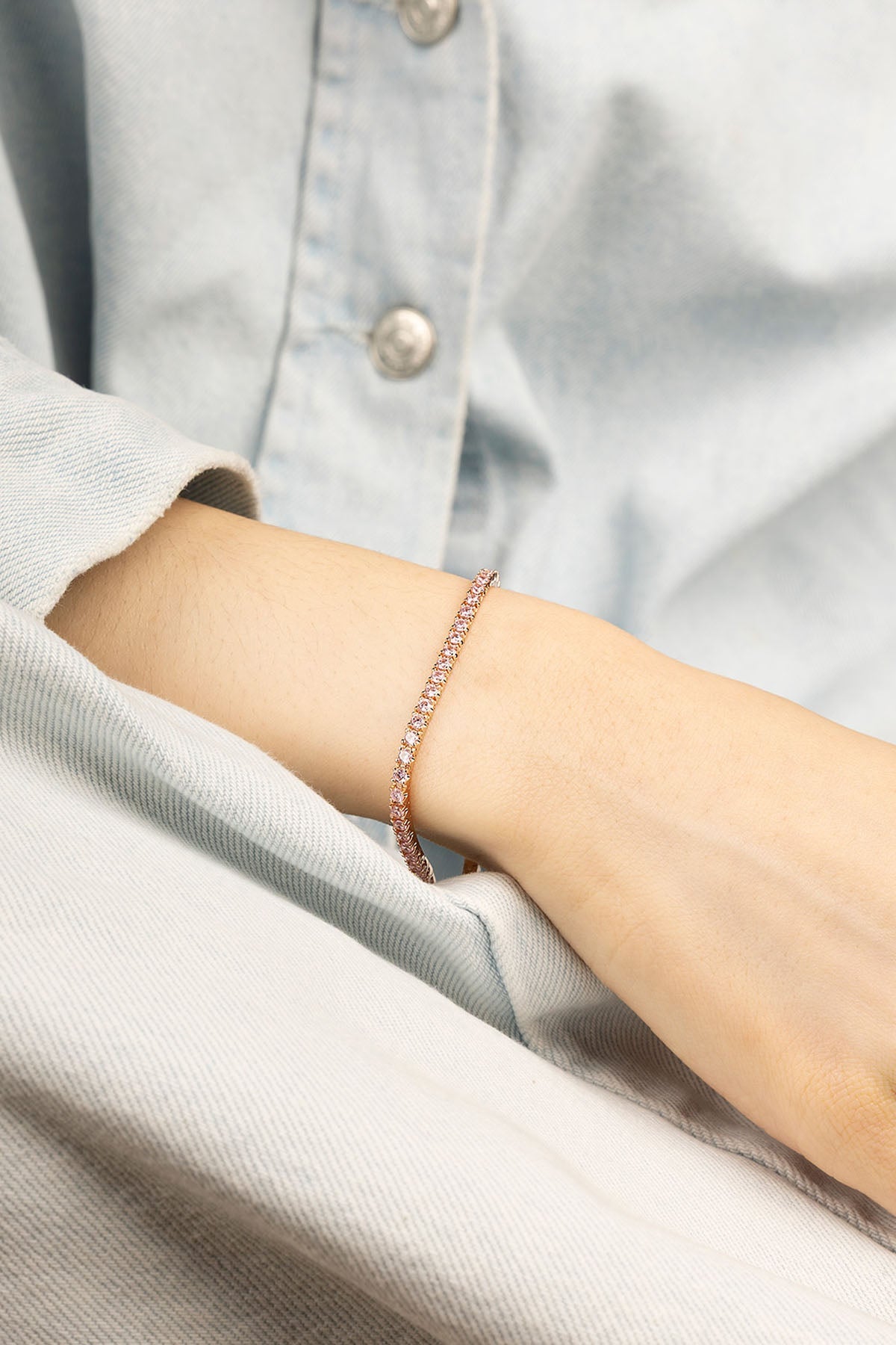 APM Monaco Tennis Bracelet in rose gold worn on hand