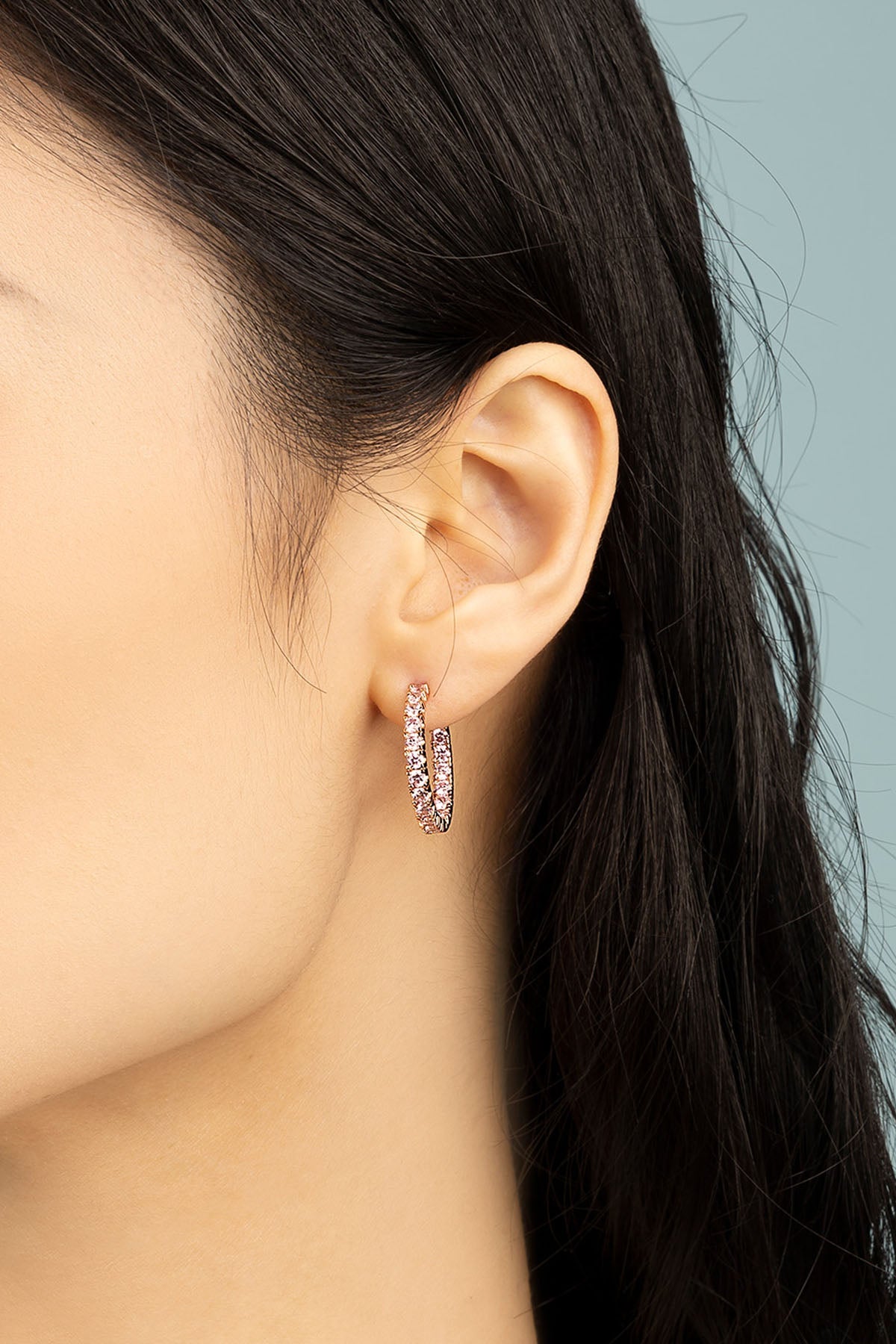 APM Monaco Pavé Hoop Earrings in Rose gold worn on ear