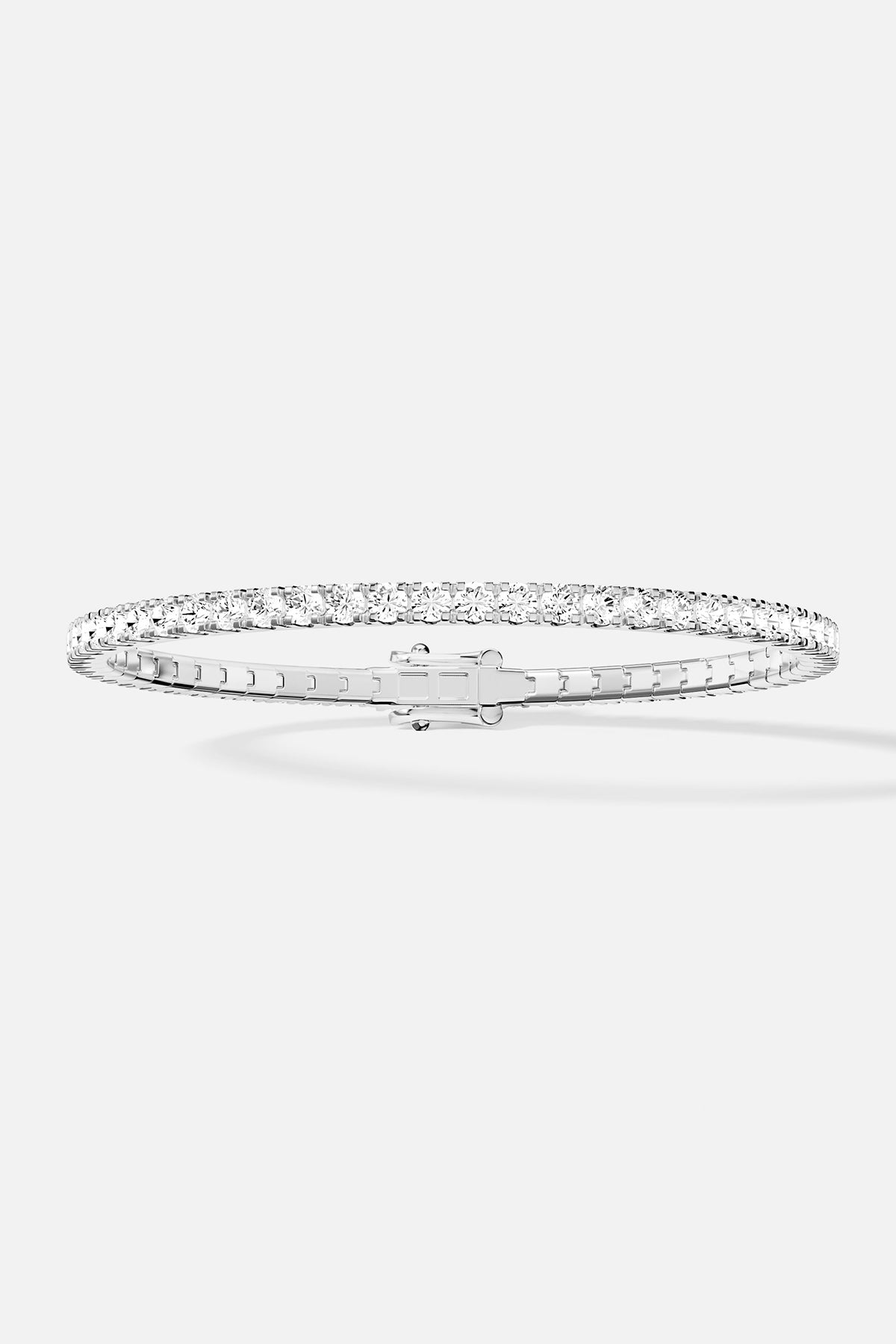 Bracelets APM Monaco pavé white stones on a silver-tone bracelet.