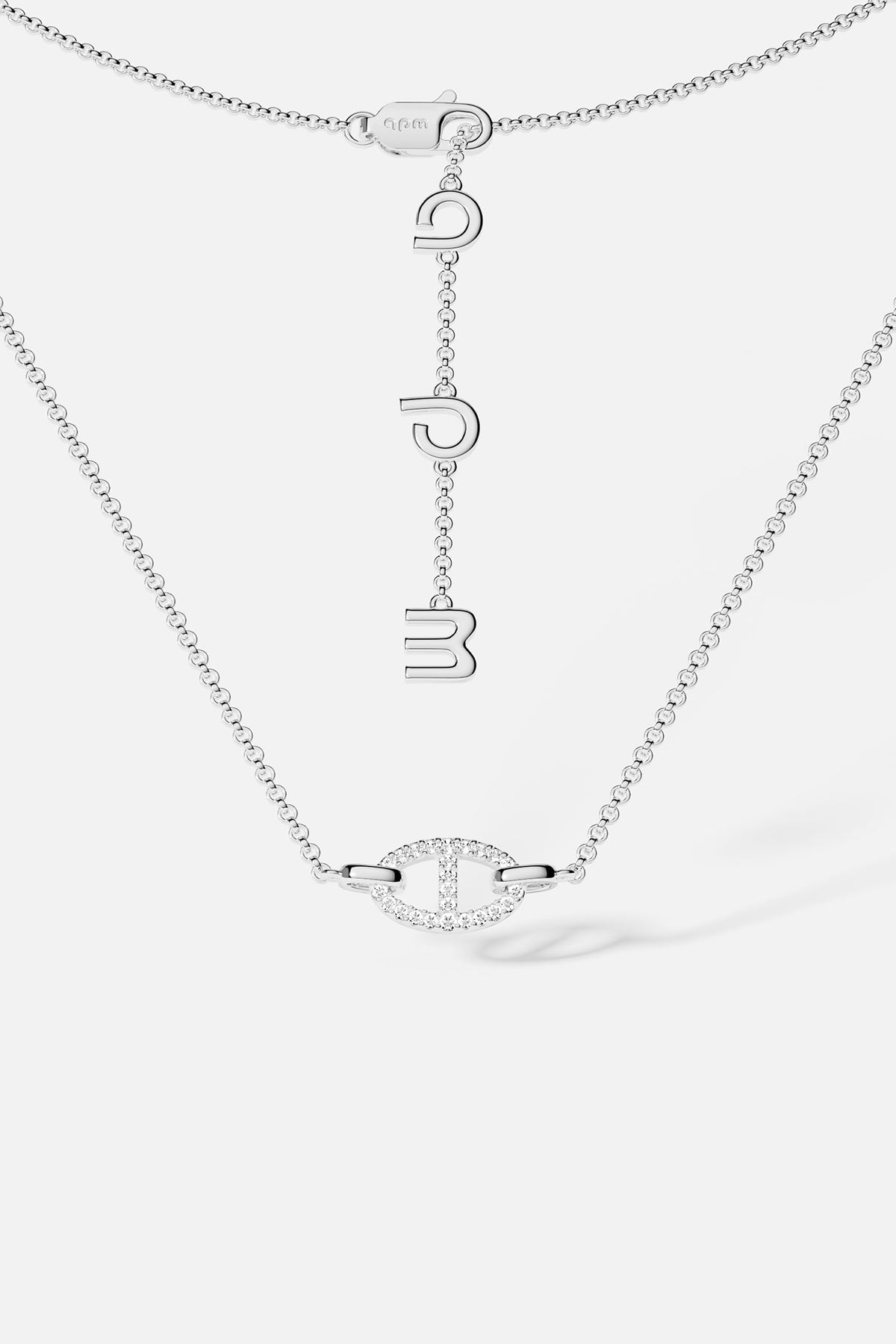 Necklaces APM Monaco, white tone, maille marine chain with a pendant of three hanging letters.