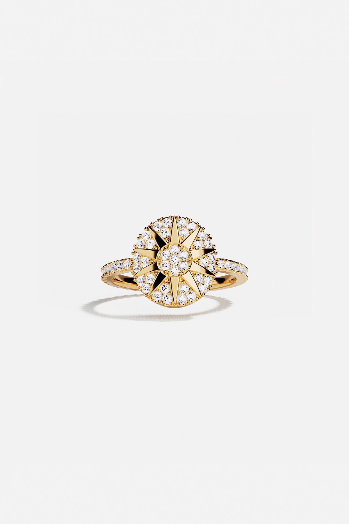 Rings APM Monaco, yellow gold pavé ring with a star motif encrusted with small diamonds.