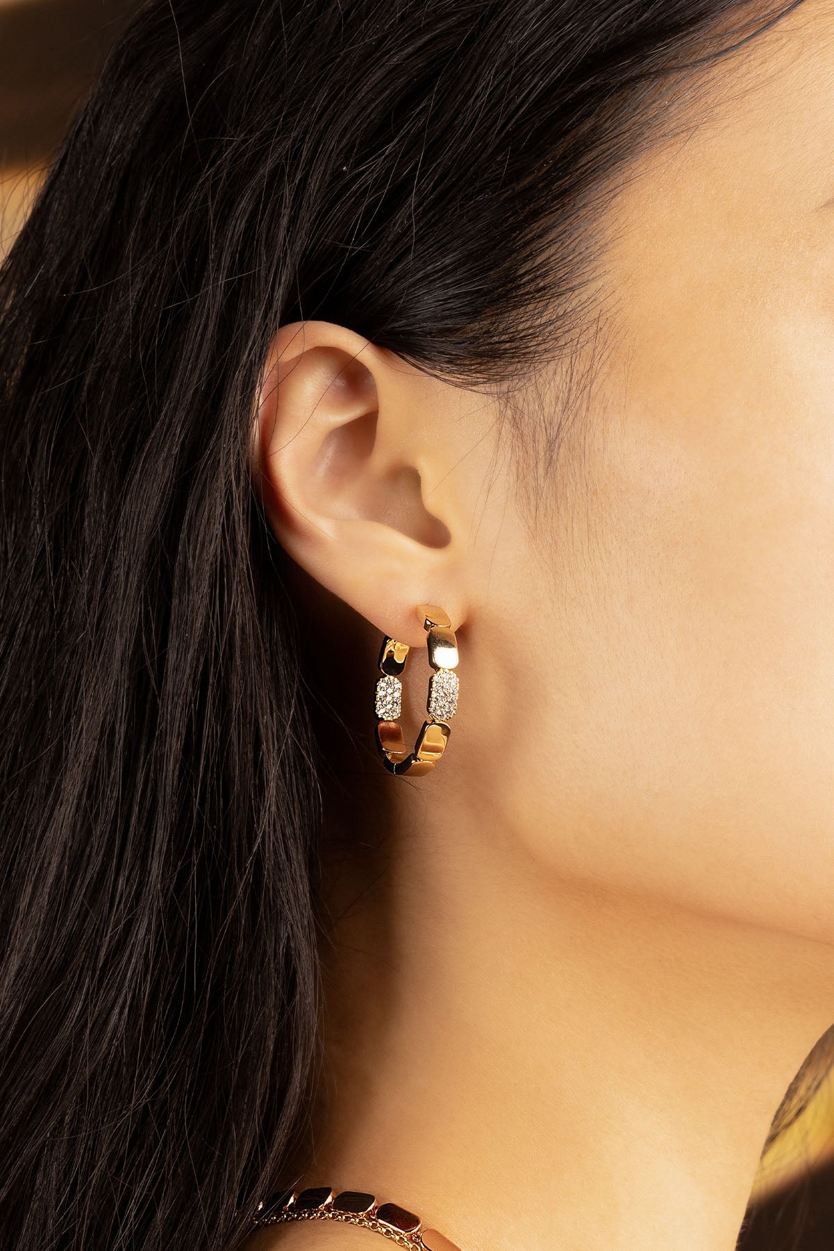 APM Monaco Dainty Gold Hoop Earrings Small  worn on ear
