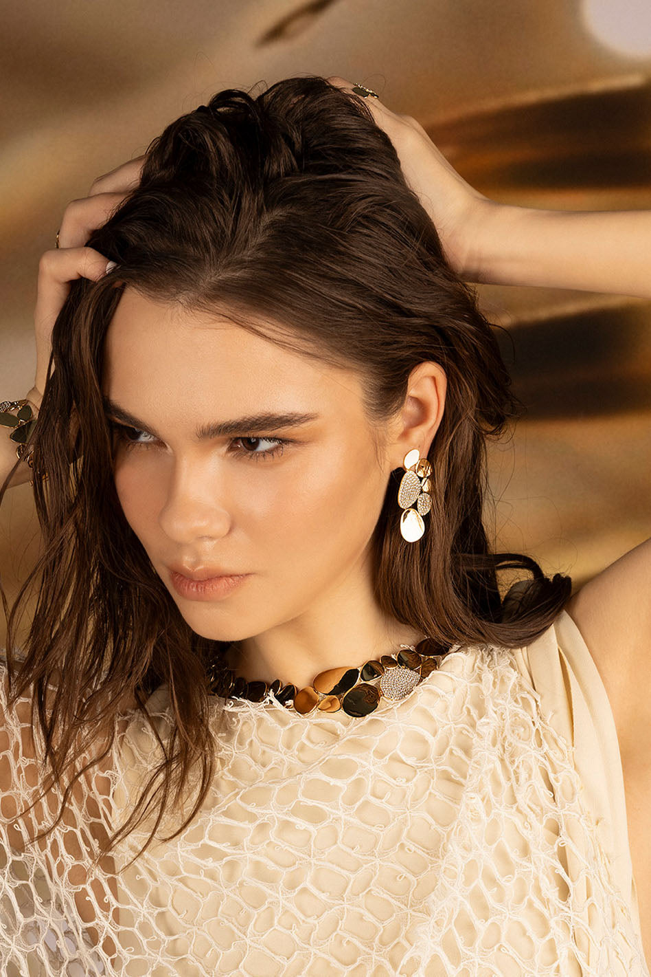 Earrings APM Monaco: statement galet earrings in yellow gold tone with multicolor stones (golden, brown, silver).